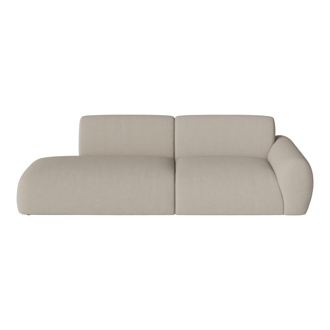 Beige curved fabric sofa with a smooth, minimalist design, perfect for modern interiors.