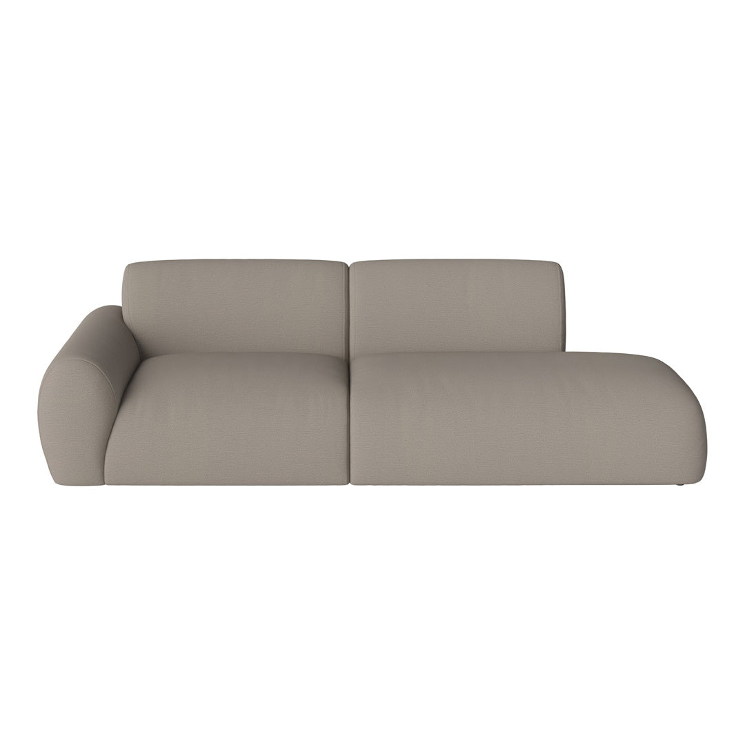 Beige modular sofa with smooth, textured upholstery and minimalist design for modern interiors.