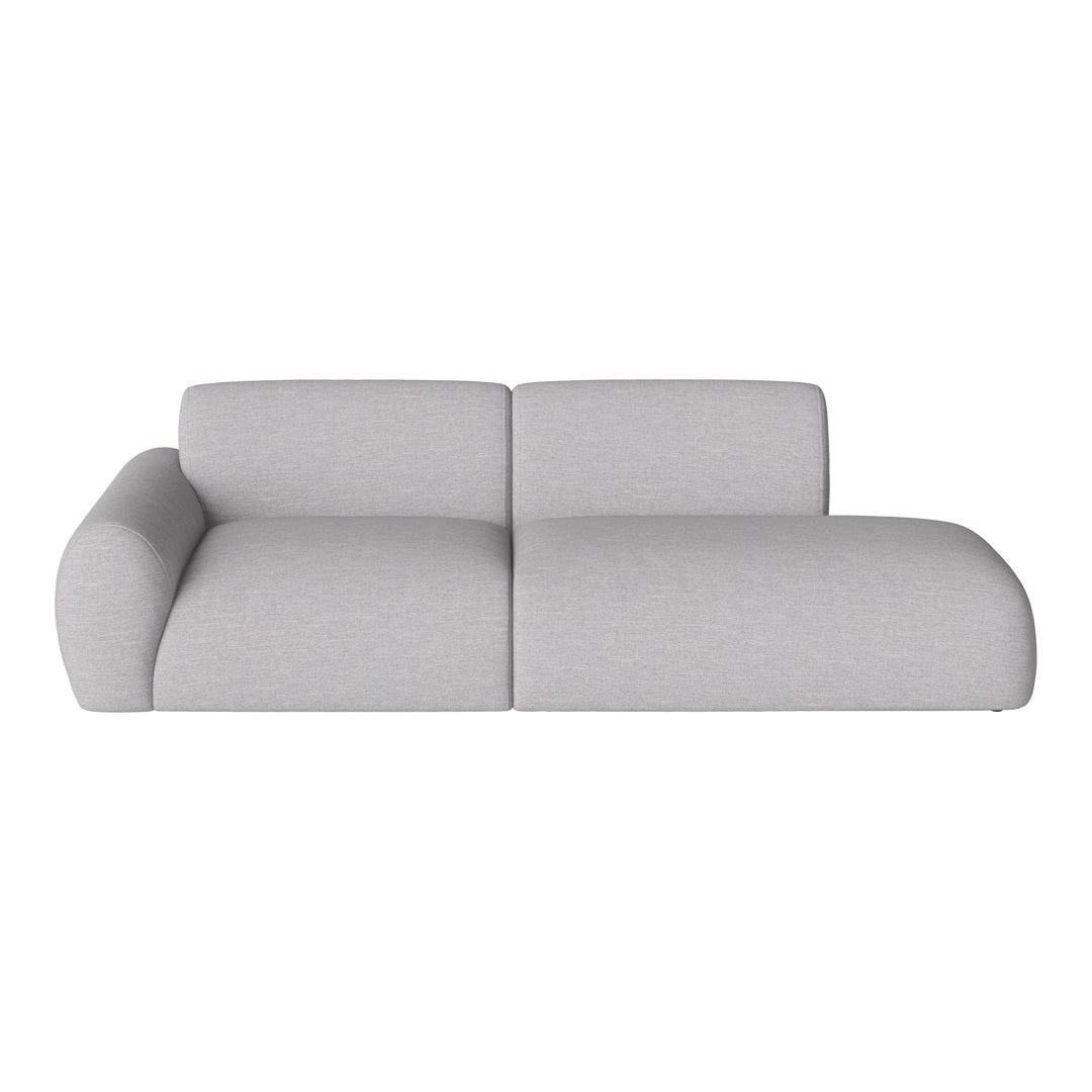 Light grey sectional sofa with a smooth, textured fabric and soft, rounded edges. Modern and minimalistic design.