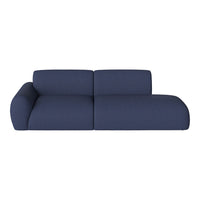Navy blue sofa with a textured pattern, featuring a contemporary design and rounded shapes for a modern look.