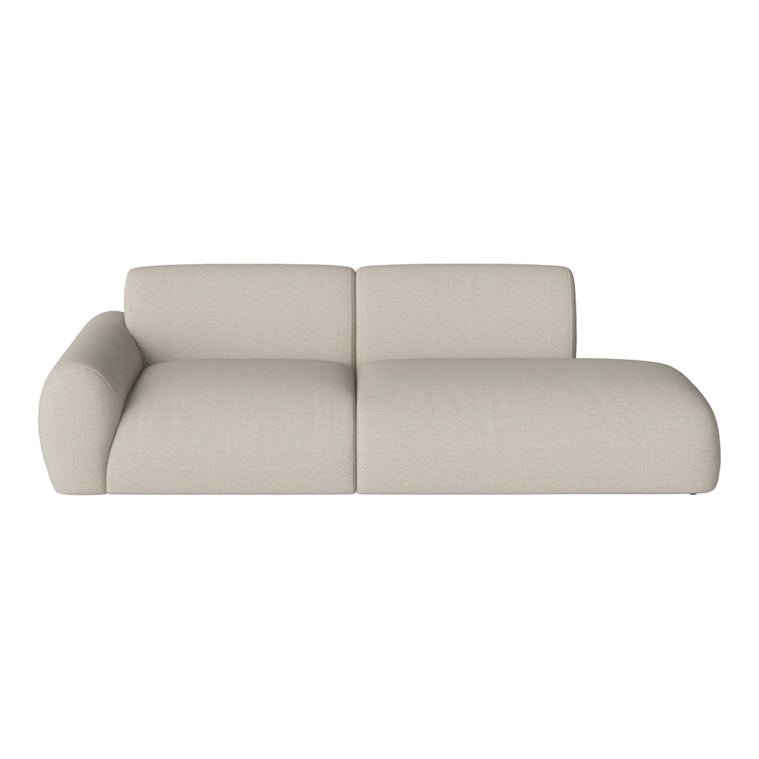 Beige fabric sofa with a smooth, textured pattern and modern, curvy design. Ideal for contemporary living spaces.