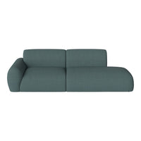 Teal upholstered sofa with a modern, textured pattern and curved arms for a contemporary living space.