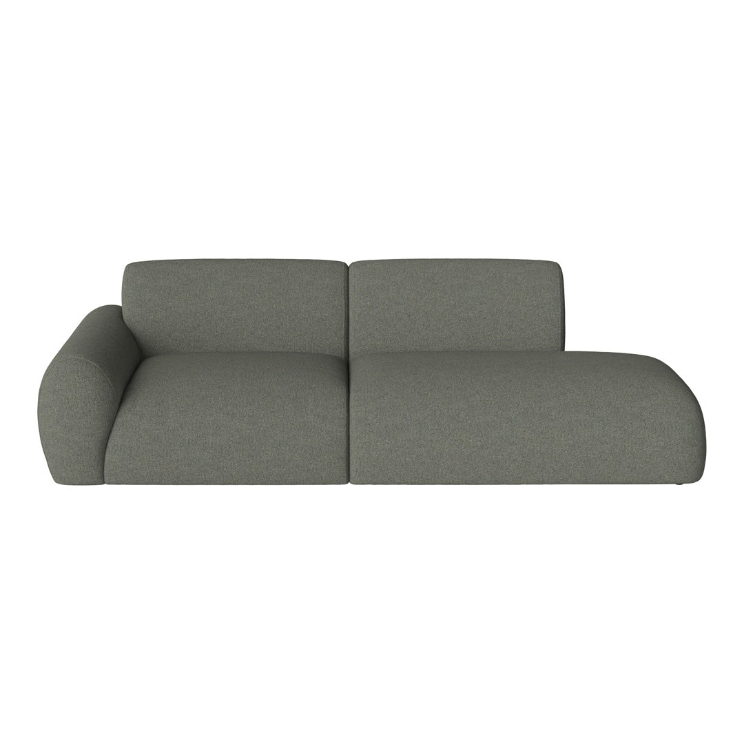 Modern gray sectional sofa with a soft, textured fabric and smooth, rounded edges. Perfect for contemporary living spaces.