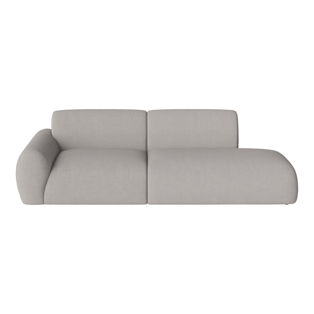 Light gray sectional sofa with a smooth, minimalistic design and soft, modern fabric texture.