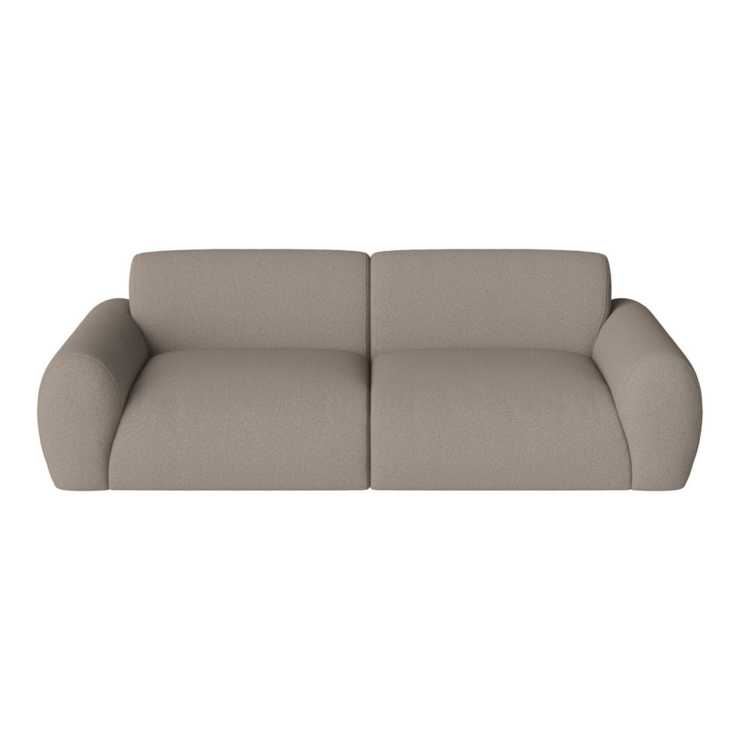 Stylish beige sofa with a smooth texture and rounded edges, perfect for modern living spaces.