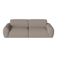 Stylish beige sofa with a smooth texture and rounded edges, perfect for modern living spaces.