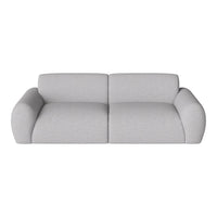 Light gray sofa with a smooth texture and minimal pattern, featuring plush, rounded armrests.