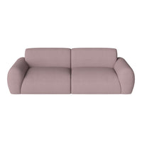 Light pink modern sofa with smooth, curved lines, perfect for stylish living room decor.
