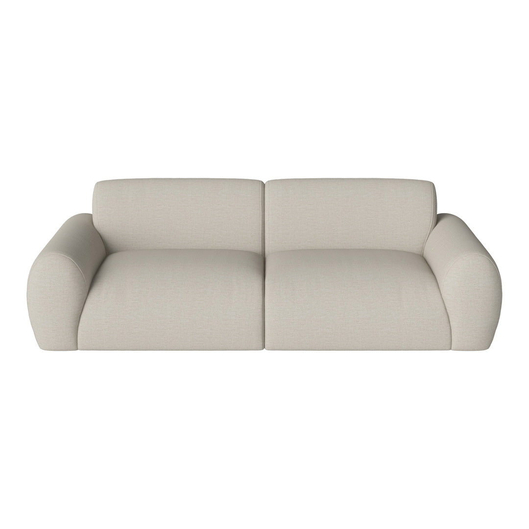 Beige upholstered sofa with a smooth texture and rounded edges, perfect for modern living spaces.