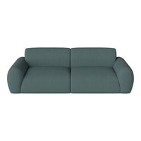 Teal fabric sofa with a textured pattern, featuring rounded arms for a contemporary look. Ideal for modern interiors.