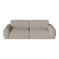 Light beige sofa with a textured fabric and smooth, rounded edges, perfect for a cozy living space.