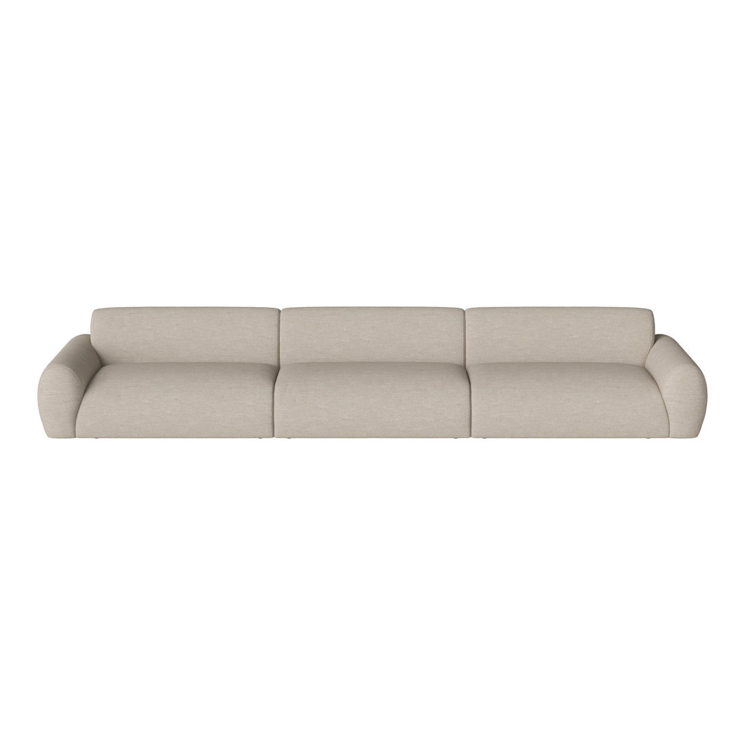Beige fabric sofa with a smooth texture and minimalist design, featuring soft curves and a seamless appearance.
