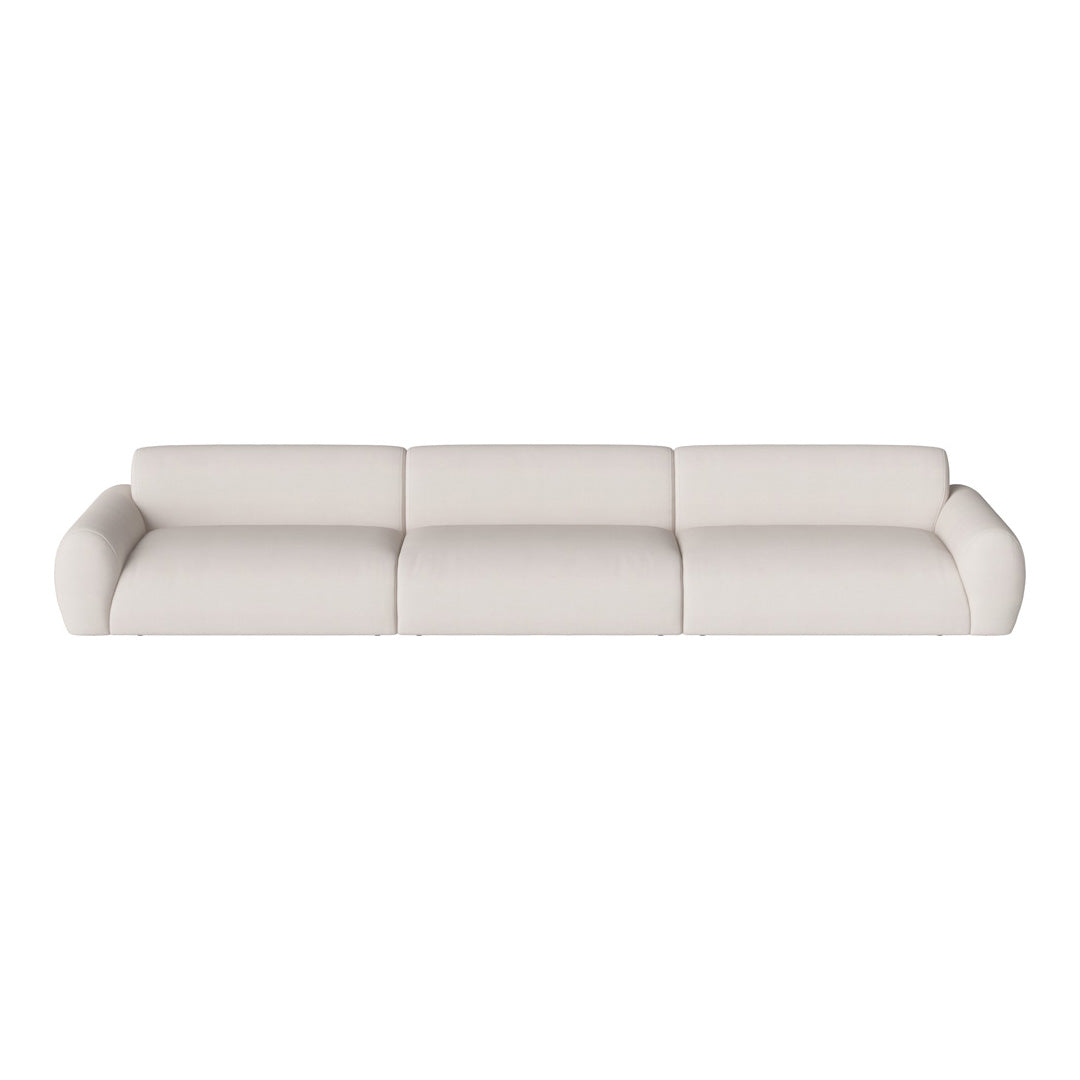 Modern beige upholstered sofa with smooth, no-patterned fabric and rounded arms for a minimalist look.