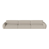 Beige sectional sofa with a smooth, modern design and rounded edges, perfect for contemporary living spaces.