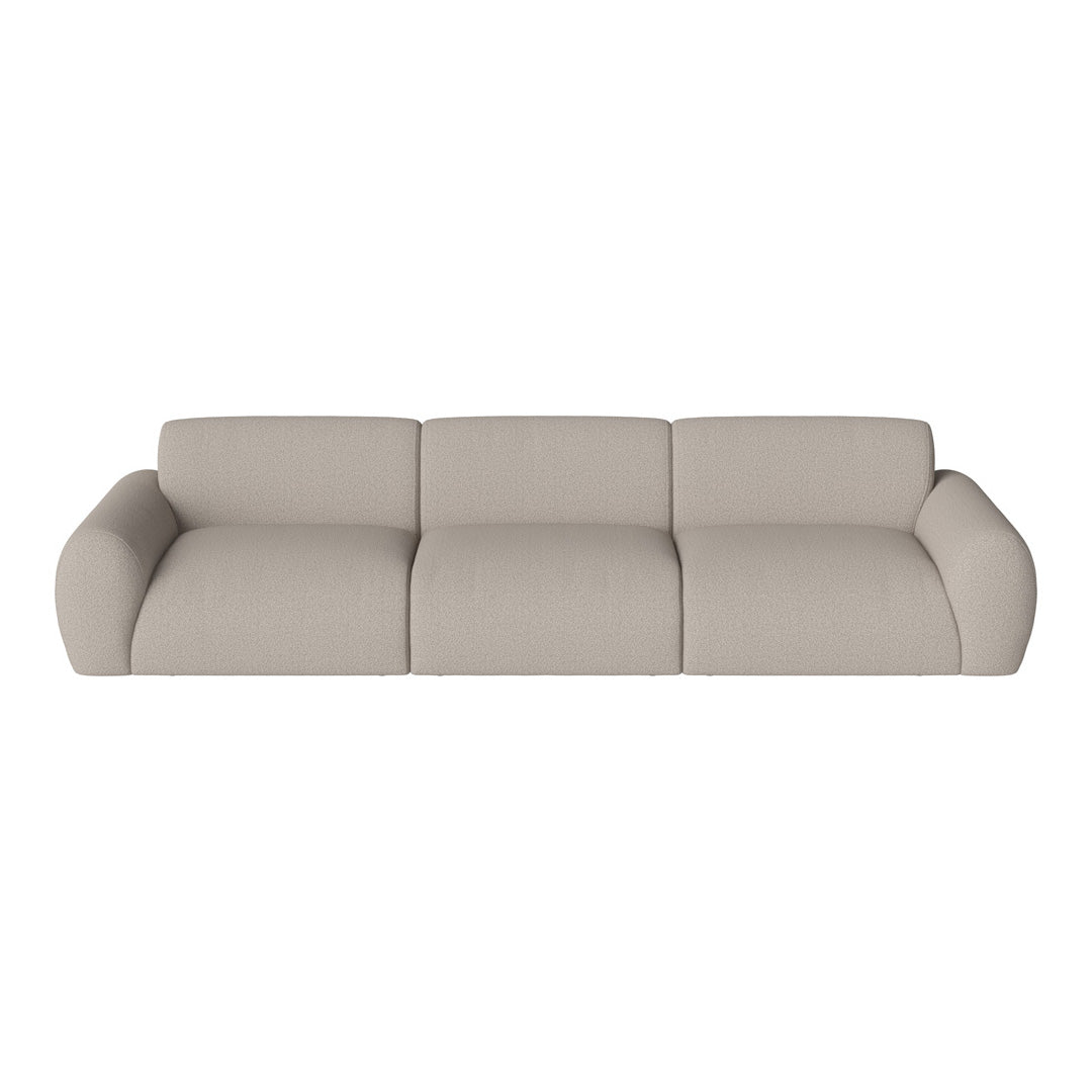 Beige upholstered sofa with soft, textured fabric and smooth, rounded edges in a modern design.