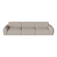Beige upholstered sofa with soft, textured fabric and smooth, rounded edges in a modern design.