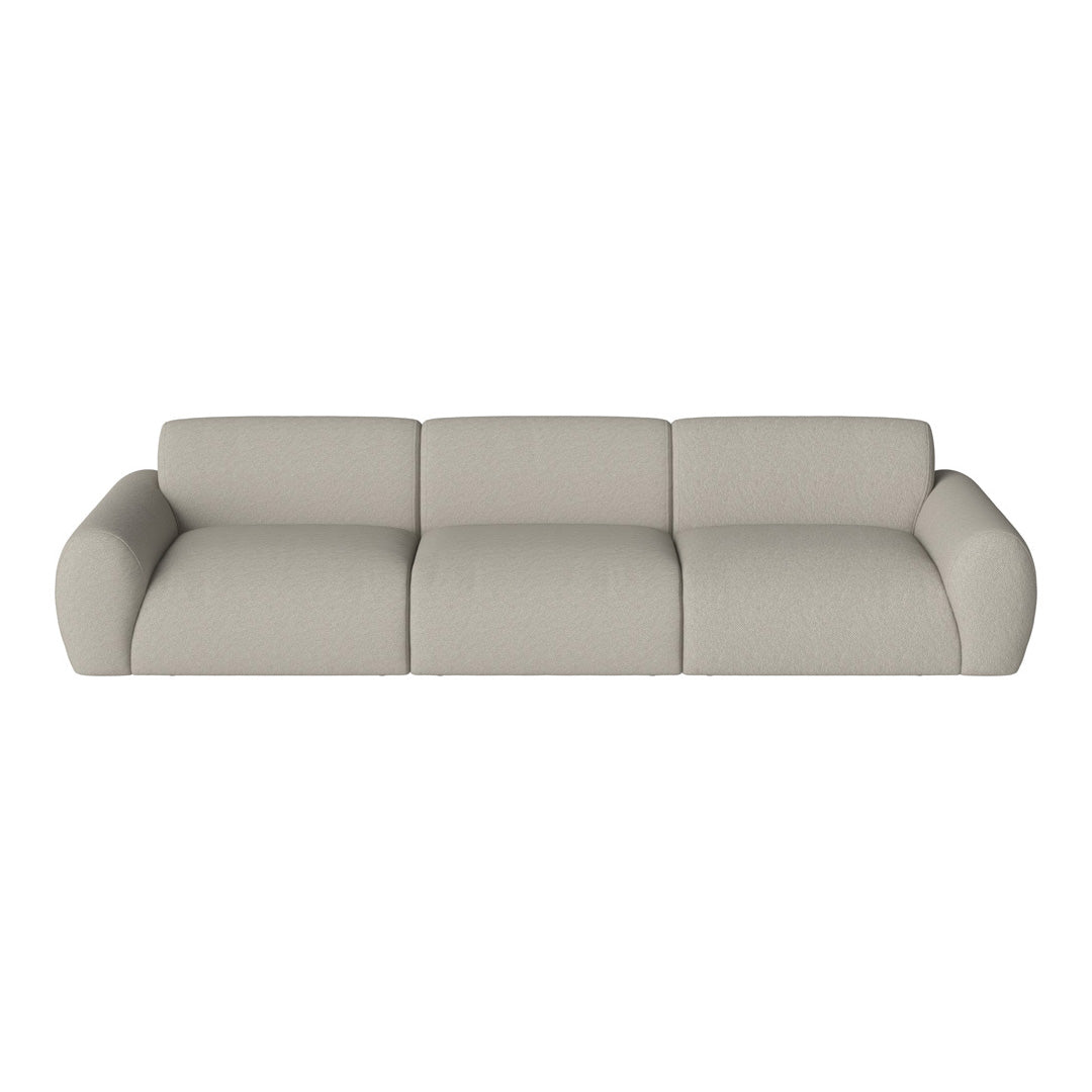 Light beige three-seater sofa with soft, smooth upholstery and rounded arms, ideal for modern living spaces.