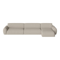 Beige modular sofa with a soft texture and minimalistic design, featuring subtle curves and clean lines.