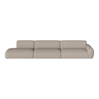 Beige sectional sofa with smooth, curved lines and a minimalist design, perfect for modern living spaces.