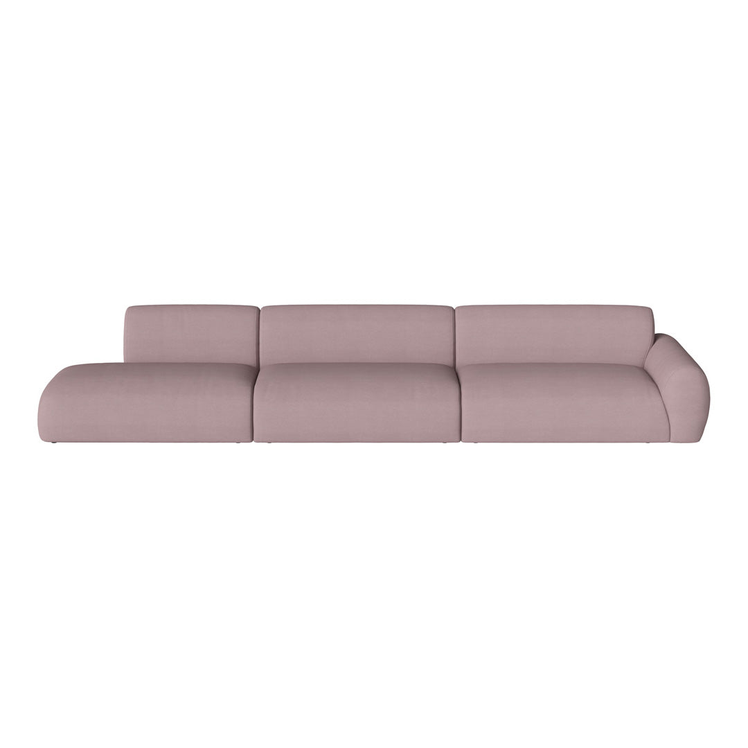 Modern sofa in a soft pink hue with smooth, curved lines and a minimalist design for contemporary spaces.