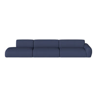 Blue modern sectional sofa with smooth, textured fabric and curved edges, ideal for contemporary living spaces.