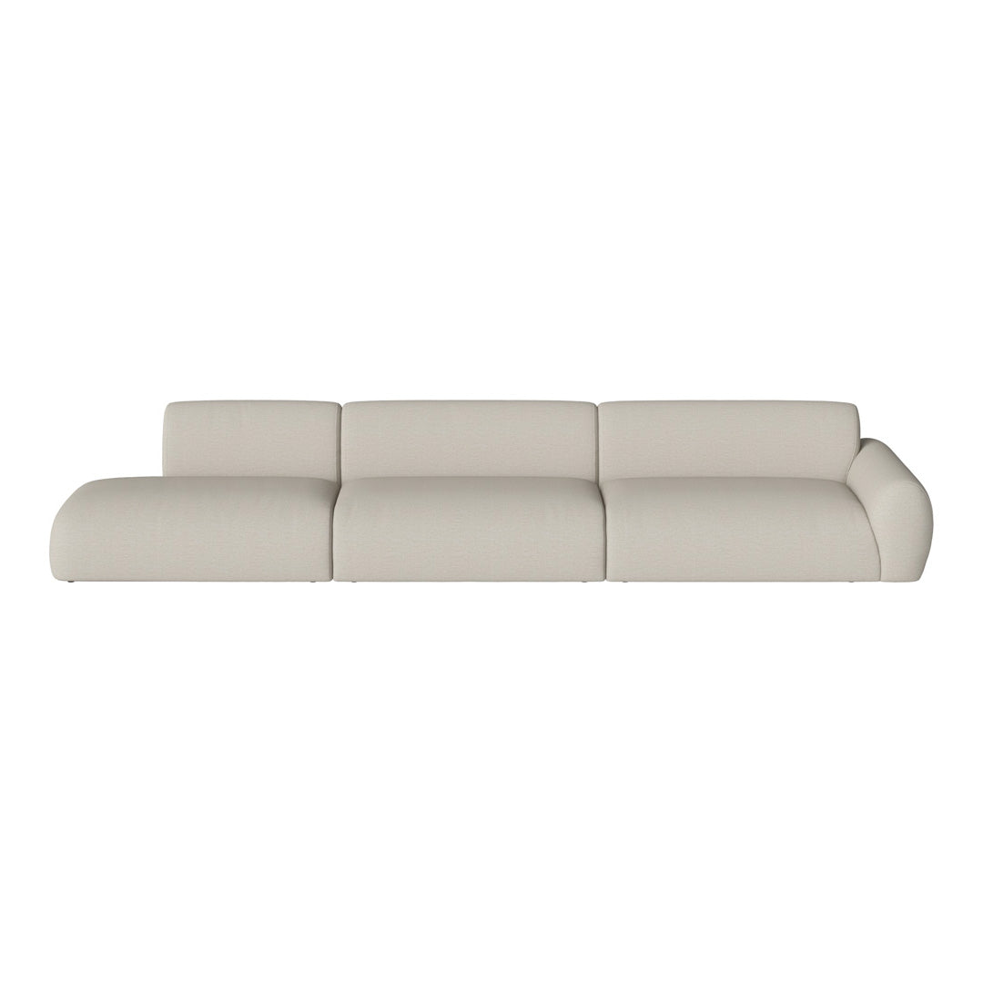 Beige sectional sofa with soft, textured upholstery and modern, rounded edges. Perfect for minimalist decor.