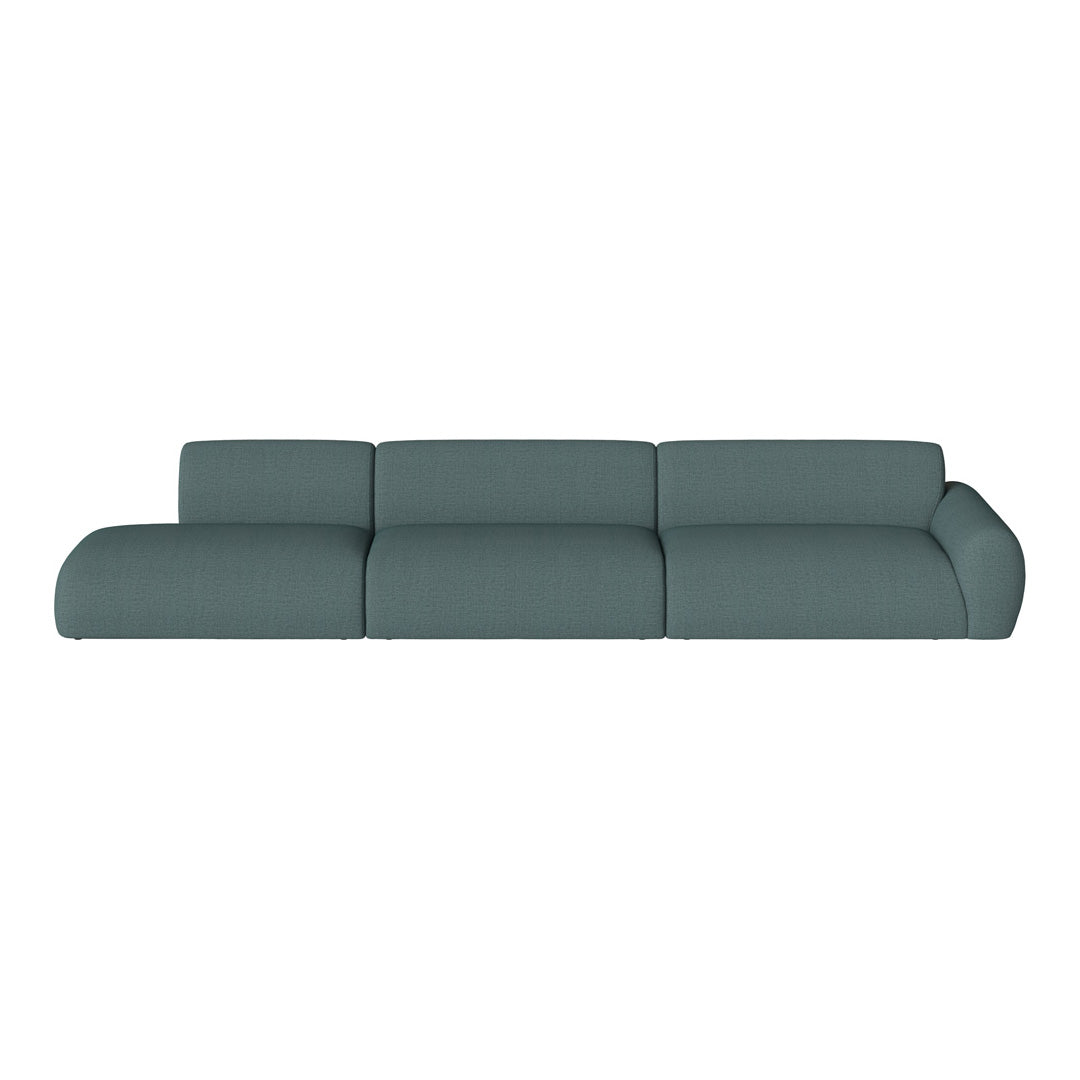 Modern teal sectional sofa with a textured fabric pattern, featuring smooth curves and a minimalist design.