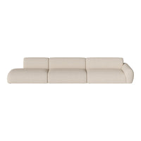 Light beige sectional sofa with a soft, textured fabric and minimalistic design for a modern aesthetic.