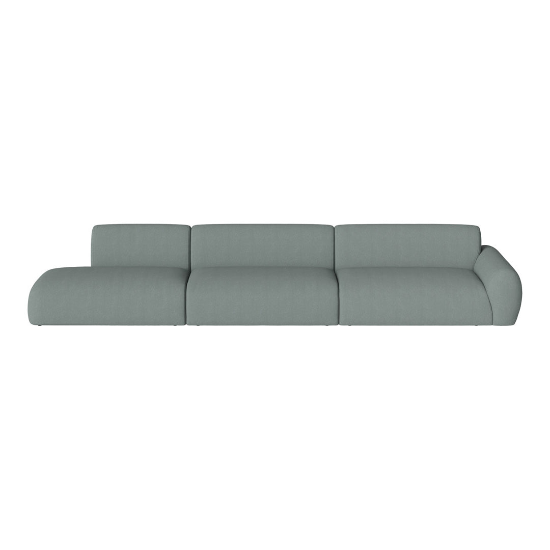 Light gray sectional sofa with a smooth, minimalist design and soft, textured fabric. Perfect for modern living spaces.