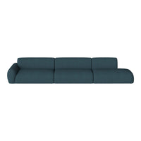 Teal modular sofa with a subtle textured pattern, featuring smooth lines and a contemporary design.