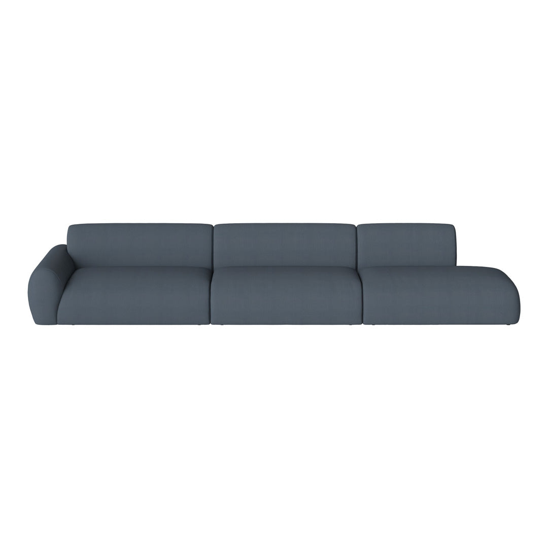 Modern sofa in deep navy blue, featuring a sleek, minimalist design and textured fabric. Perfect for contemporary decor.