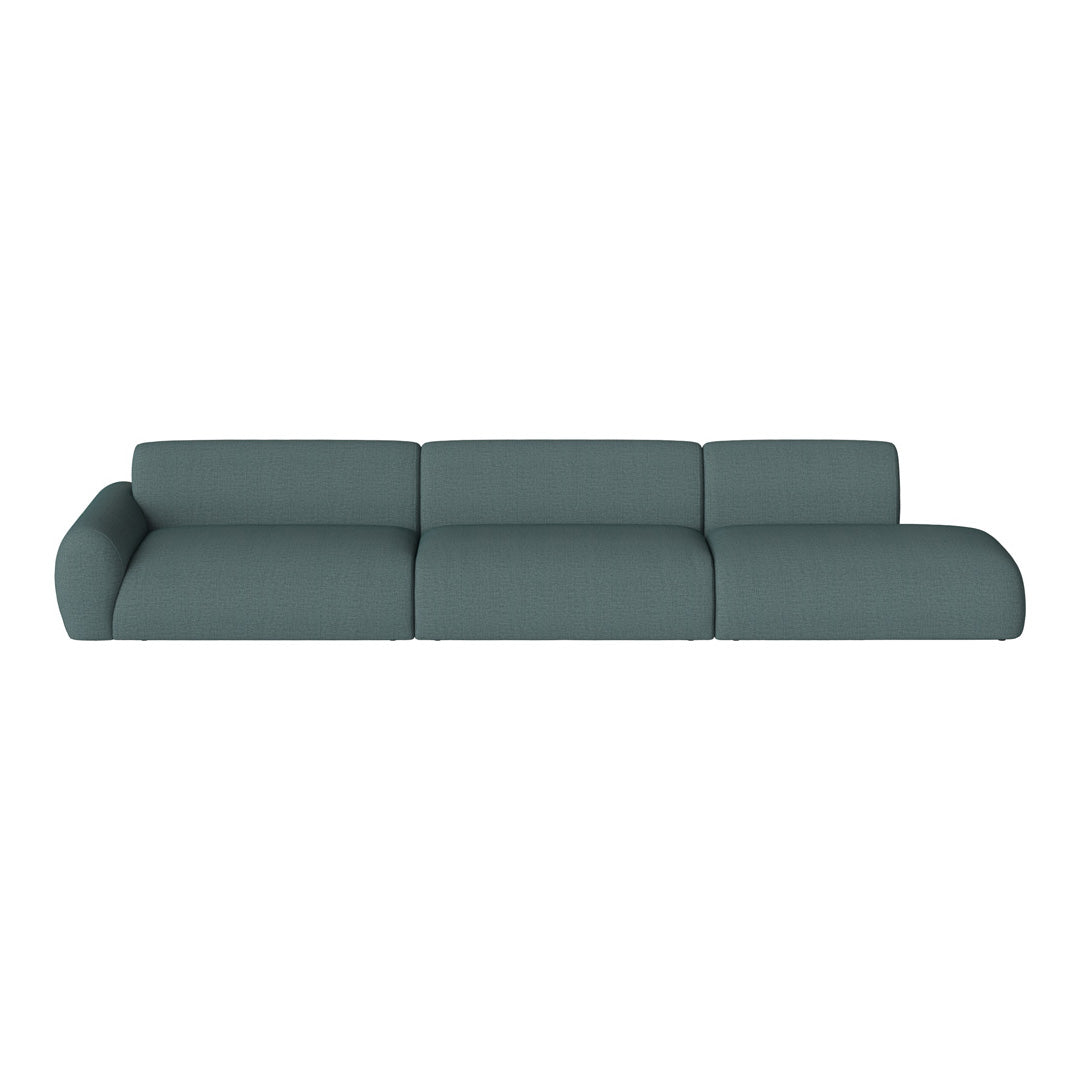 Teal sectional sofa with a textured fabric, featuring a modern, minimalist design and smooth curves.