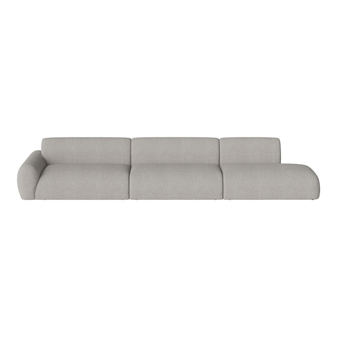 Gray sectional sofa in a smooth, minimalist design with soft, textured fabric. Perfect for modern interiors.