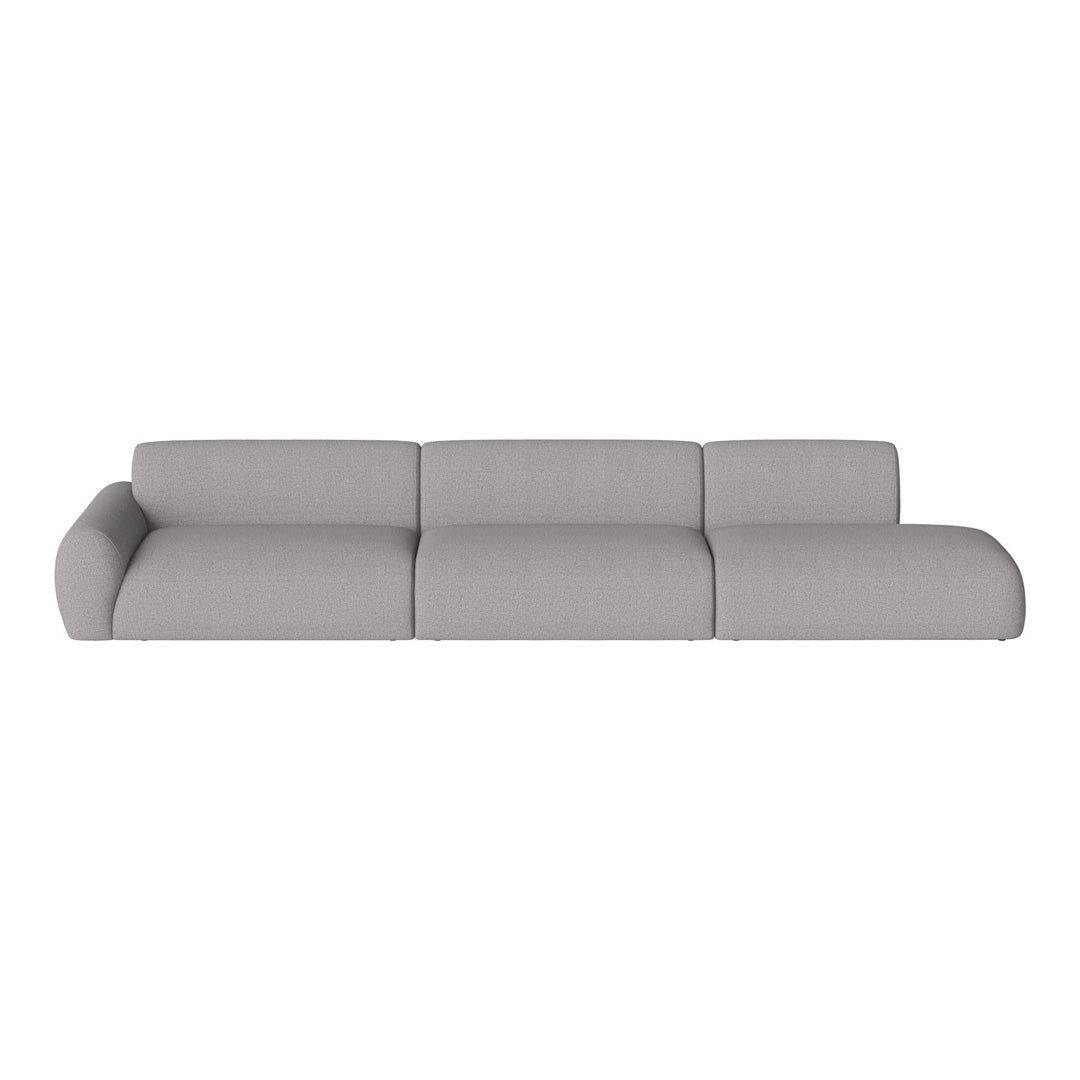 Gray sectional sofa with a modern, minimalist design and smooth textured fabric. Ideal for contemporary living spaces.