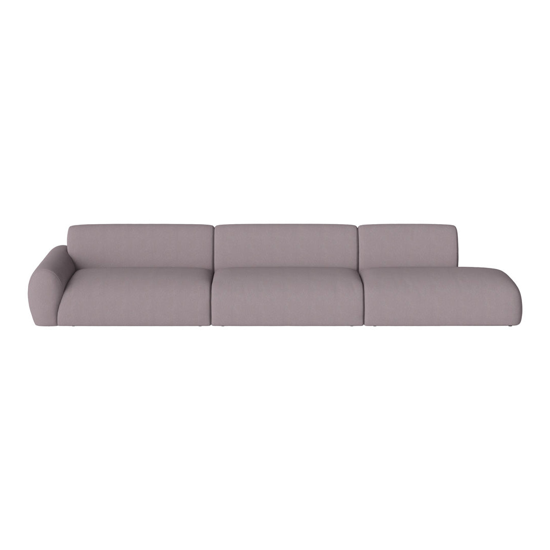 Stylish modern sofa in soft pastel lavender fabric with smooth, minimalistic design and no patterns.