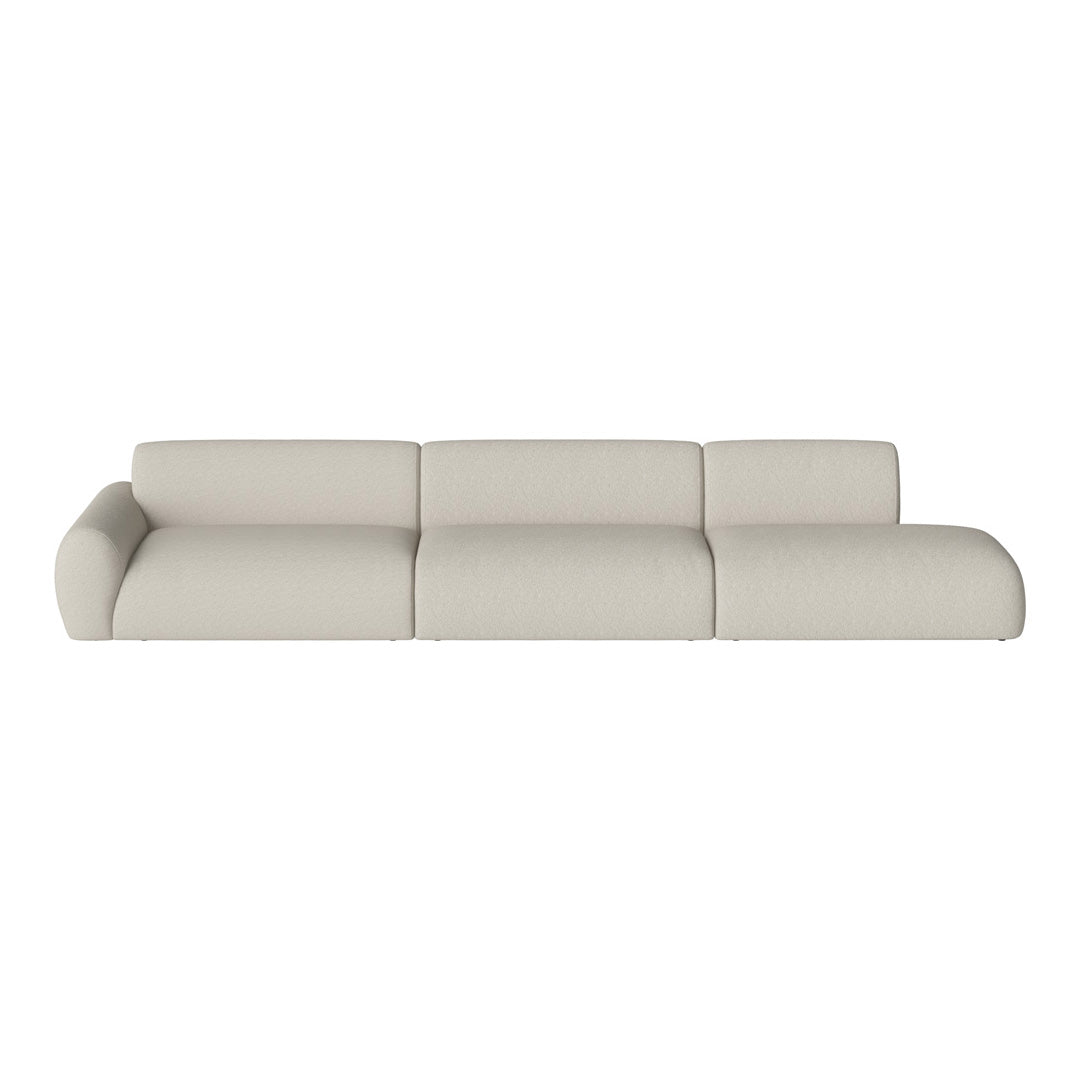 Cream-colored modern sectional sofa with a soft, textured fabric and rounded cushions, enhancing contemporary decor.