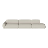 Cream-colored modern sectional sofa with a soft, textured fabric and rounded cushions, enhancing contemporary decor.