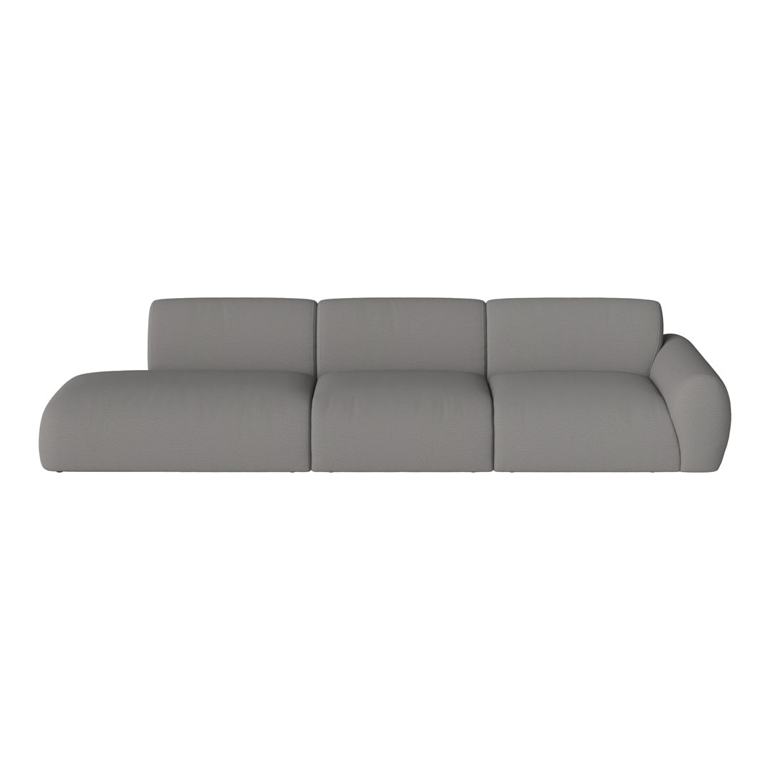 Soft grey sectional sofa with rounded edges and textured fabric, perfect for modern living spaces.