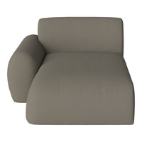Modern chaise lounge in soft taupe fabric with a subtle textural pattern.
