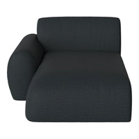 Dark gray chaise lounge with textured fabric pattern for a modern look. Stylish and contemporary design perfect for any room.