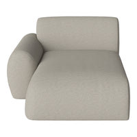 Light beige chaise lounge with a smooth, textured fabric and a modern, minimalist design. Perfect for any decor.