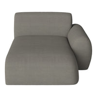 "Soft gray chaise lounge with a smooth texture and subtle ribbed pattern, ideal for modern decor."