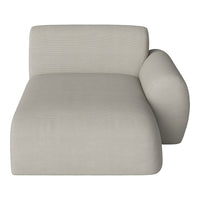 Light beige chaise lounge with subtle ribbed texture and smooth curved arm for a modern aesthetic.