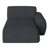 Dark gray textured fabric lounge chair with smooth, minimalist design and modern lines.