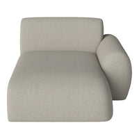 Light beige textured chaise lounge with a modern, minimalist design. Perfect for any contemporary living space.