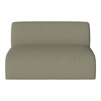 Textured light green upholstery on a modern, minimalist lounge chair. Perfect for contemporary decor.