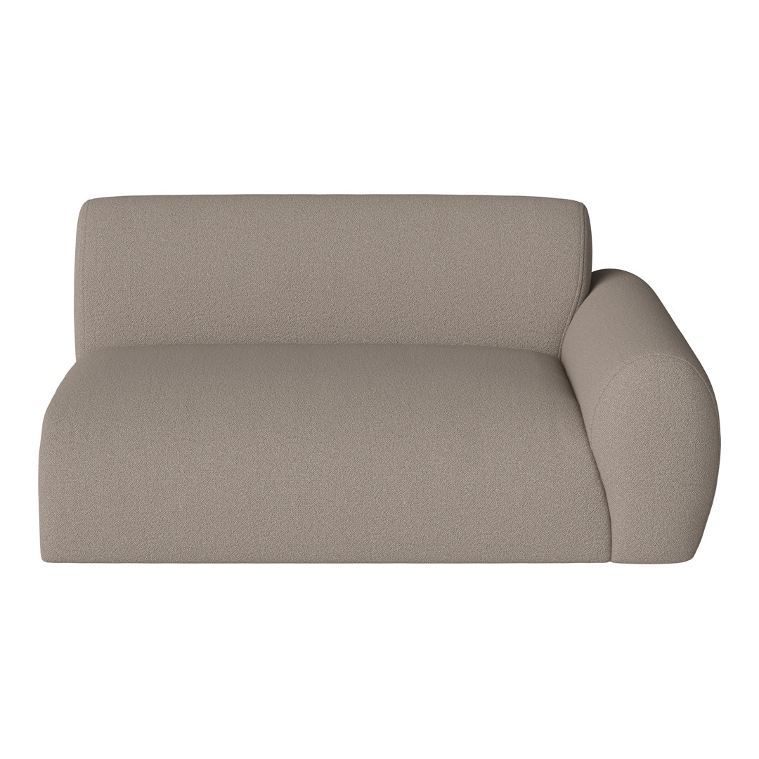 Soft beige sofa with a textured, minimalist design and rounded armrest, perfect for modern decor.
