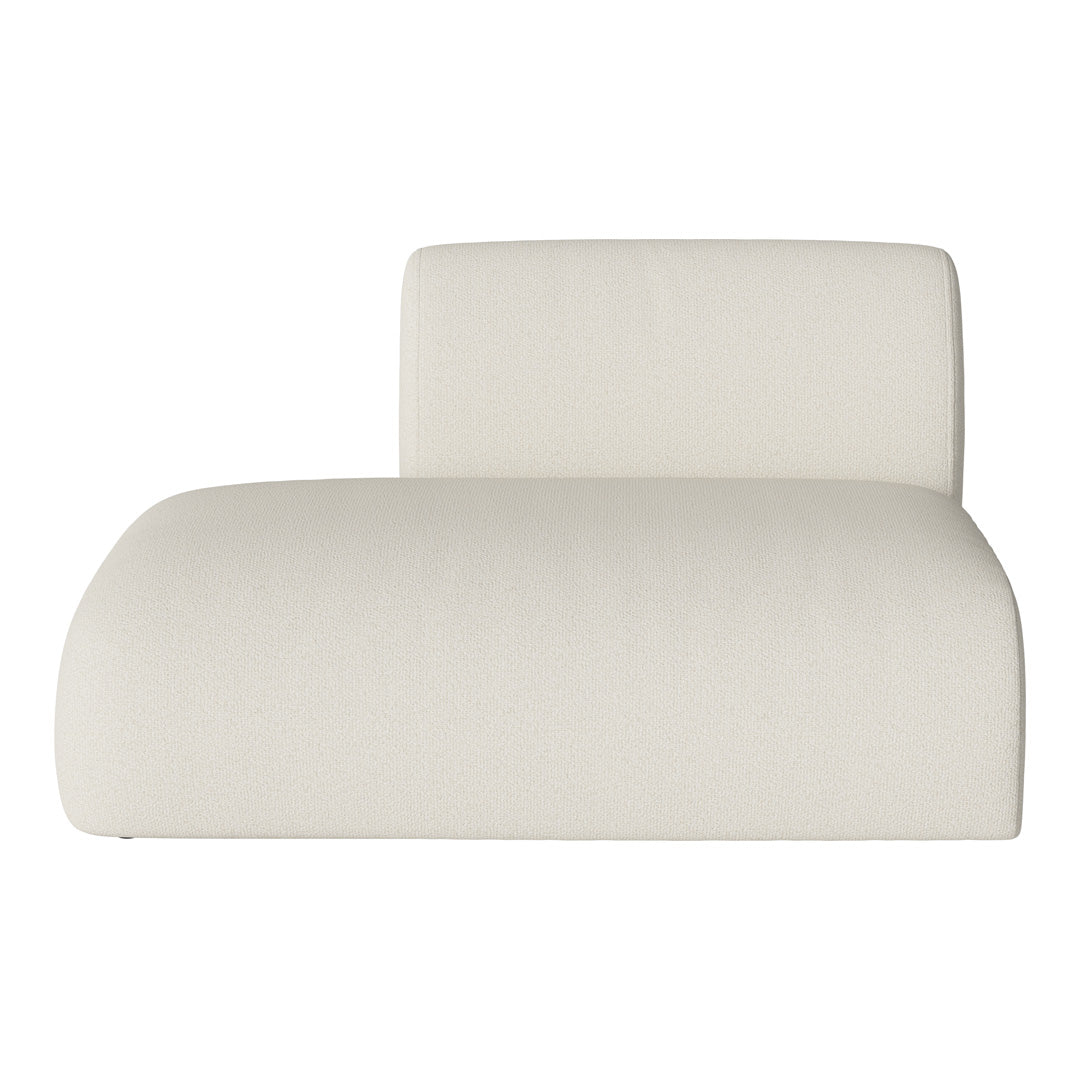 Cream-colored lounge chair with a soft, textured fabric pattern. Modern and minimalist design.