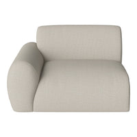 Beige textured chaise lounge with a rounded armrest, showcasing a minimalist and modern design.