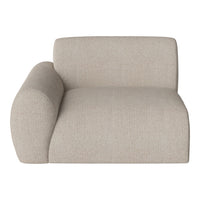 Beige fabric armchair with a textured pattern and soft, rounded shapes for a modern look.